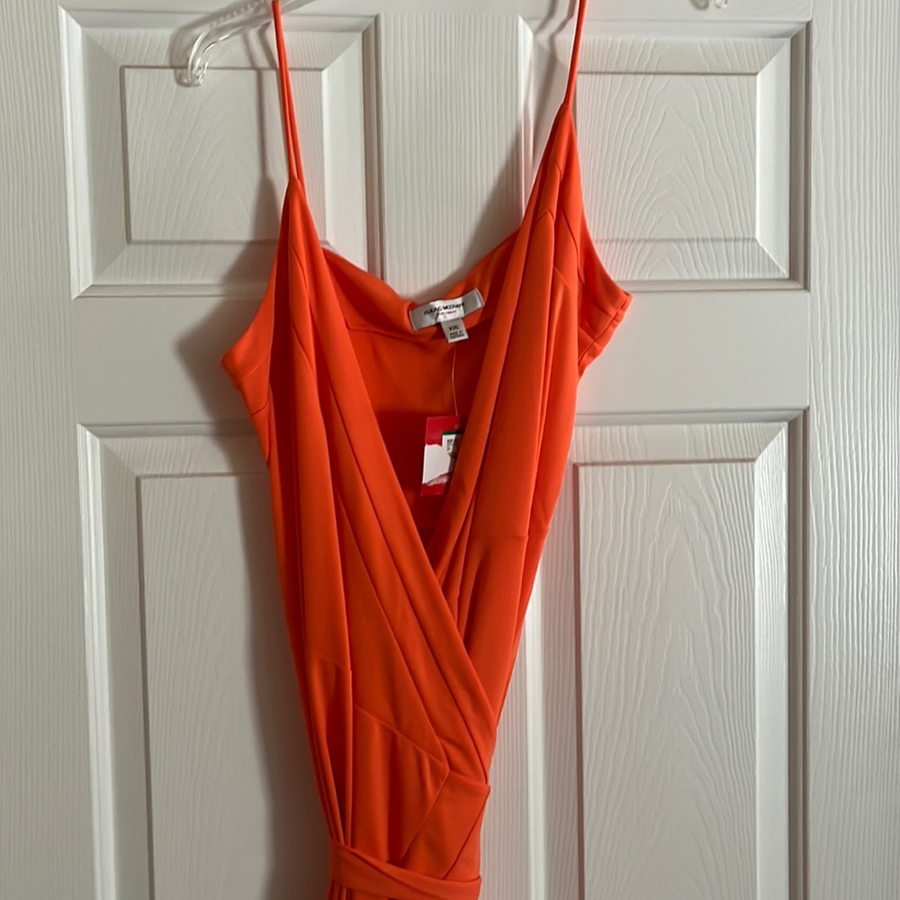 Orange spaghetti strap wrap dress. Mid length.